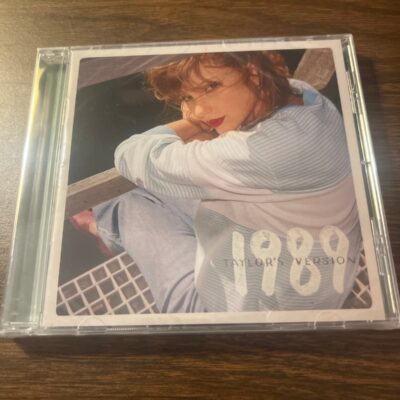 1989 cd with polaroids