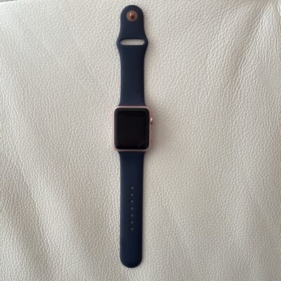 Apple Watch Series 1 with navy blue band with charger